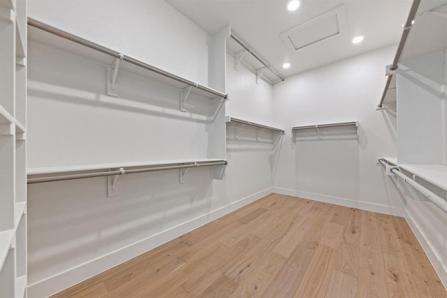 Featuring seasonal hanging space and plenty of room, there's no fighting over space in this dream owner's closet!