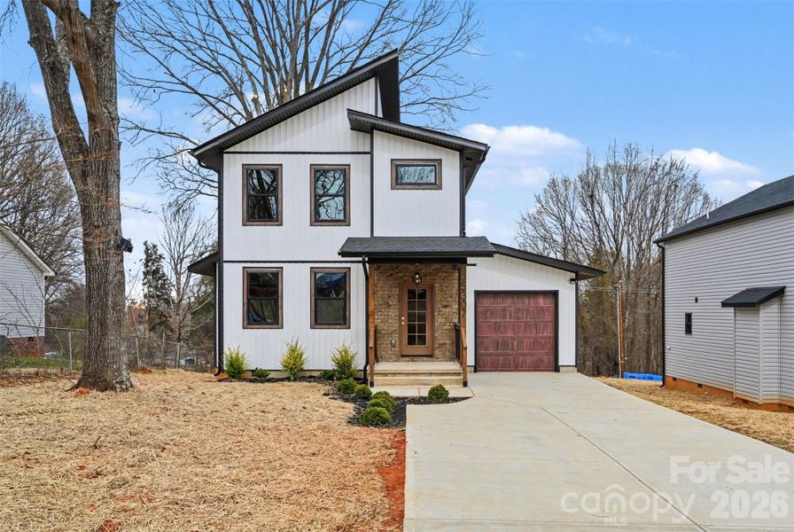 Front exterior of a new home in , Concord, NC, highlighting curb appeal (Image 17).