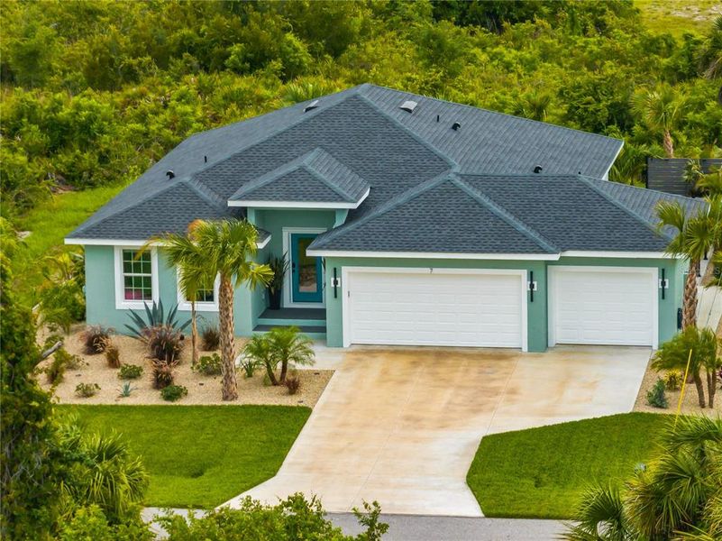 Front exterior of a new home in , Placida, FL, highlighting curb appeal (Image 24).