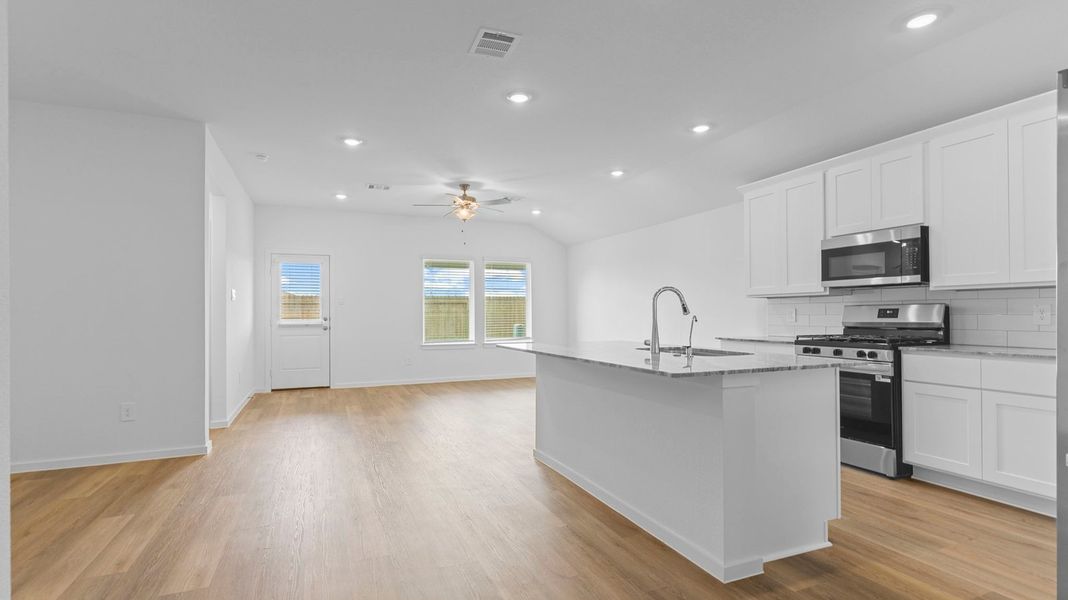 Furnished interior view inside a new home in Caldwell Crossing, Iowa Colony (Image 6).