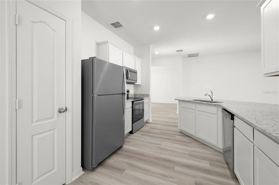 Furnished interior view inside a new home in Tula Parc, Astatula (Image 6).