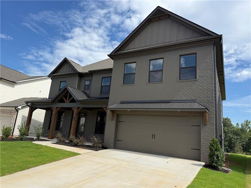 Front exterior of a new home in Ponderosa Farms Reserve, Gainesville, GA, highlighting curb appeal (Image 29). Front exterior of a new home in Ponderosa Farms Reserve, Gainesville, GA, highlighting curb appeal (Image 29).