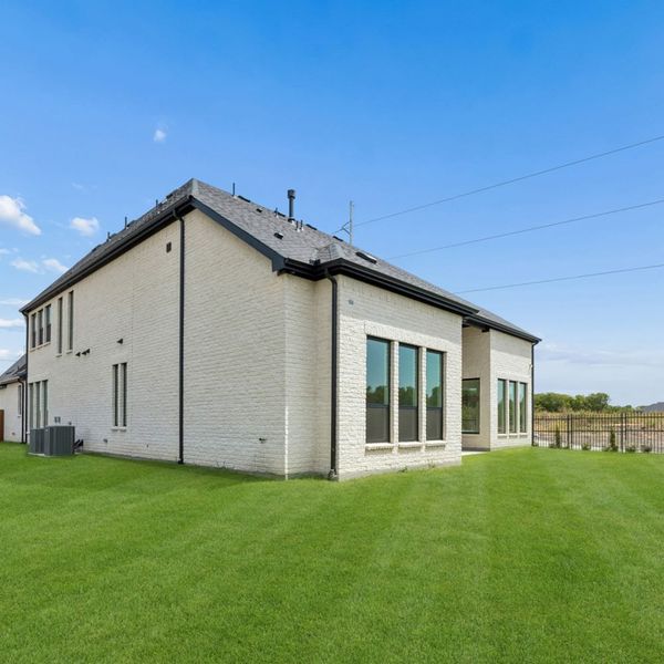 Exterior details and patio area of a home in The Parks at Wilson Creek, Celina (Image 33).