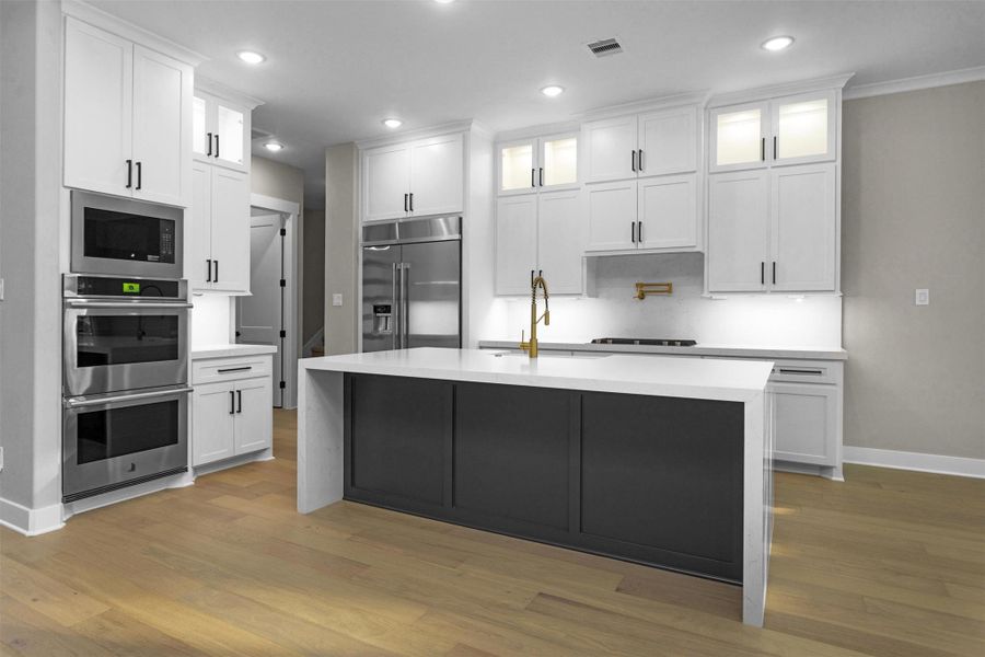 Chef’s kitchen with quartz countertops, custom cabinetry, and modern lighting for a bright and functional space. Chef’s kitchen with quartz countertops, custom cabinetry, and modern lighting for a bright and functional space.