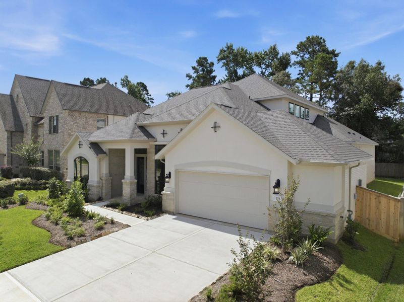 Front exterior of a new home in The Woodlands Hills 65′, Willis, TX, highlighting curb appeal (Image 26).