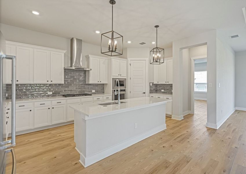 The kitchen has sprawling quartz countertops. The kitchen has sprawling quartz countertops.