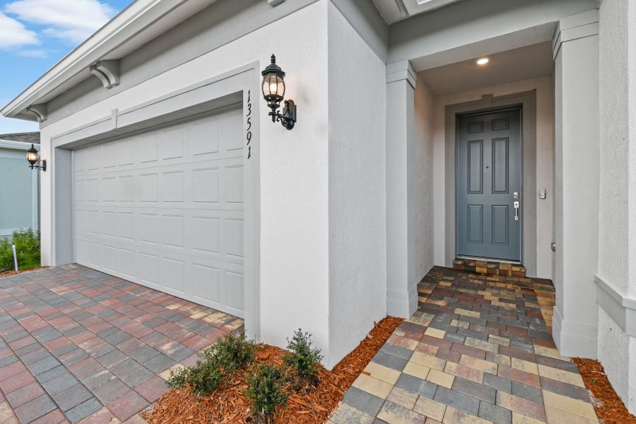 Exterior details and patio area of a home in Del Webb Tradition, Port St. Lucie (Image 3).
