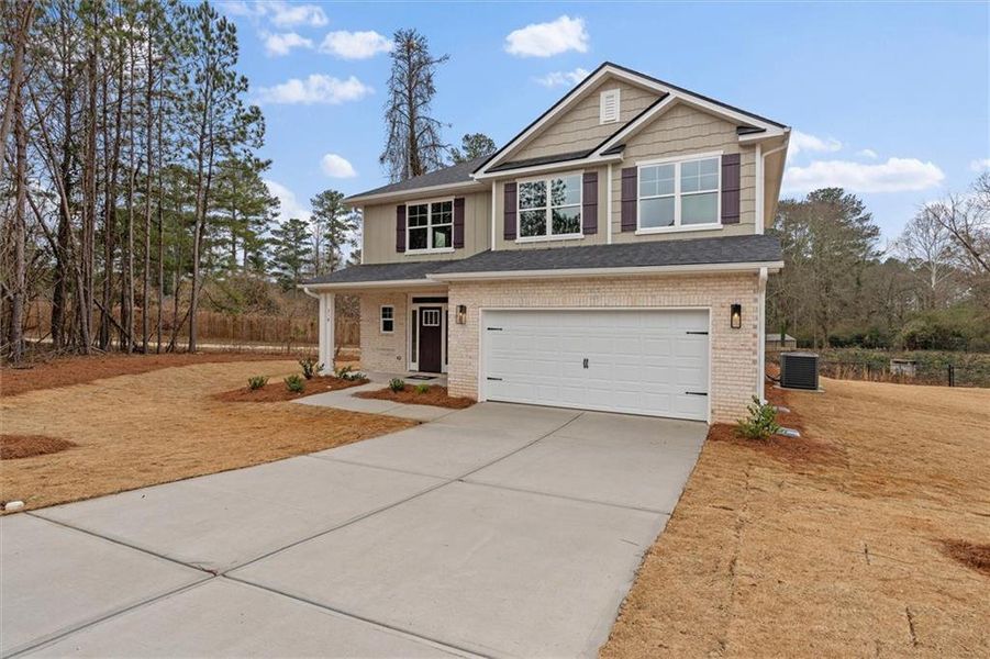 Front exterior of a new home in Canterbury Villas, Carrollton, GA, highlighting curb appeal (Image 22).