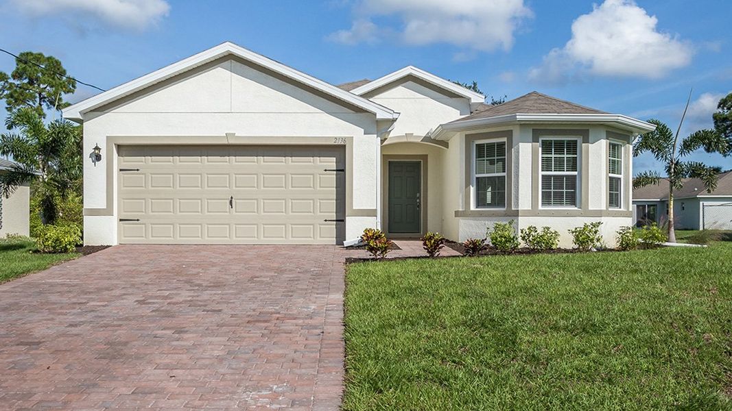 Front exterior of a home in the North Port - Express Series community, located in North Port, FL (Image 2). Front exterior of a home in the North Port - Express Series community, located in North Port, FL (Image 2).