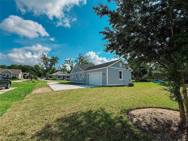 Front exterior of a new home in , Lake Helen, FL, highlighting curb appeal (Image 27). Front exterior of a new home in , Lake Helen, FL, highlighting curb appeal (Image 27).