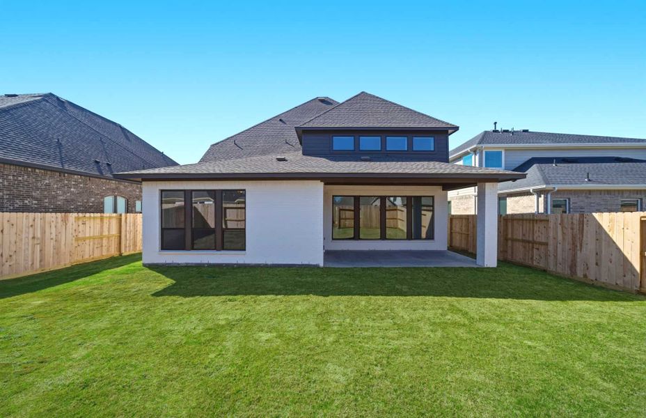Exterior details and patio area of a home in The Highlands 55′, Porter (Image 26).