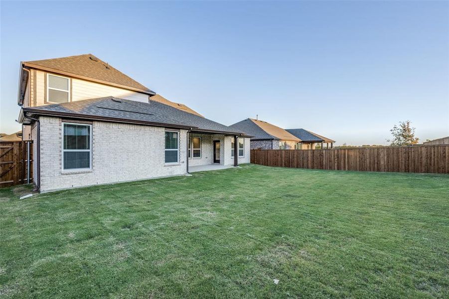 Exterior details and patio area of a home in The Preserve Estates, Justin (Image 18).