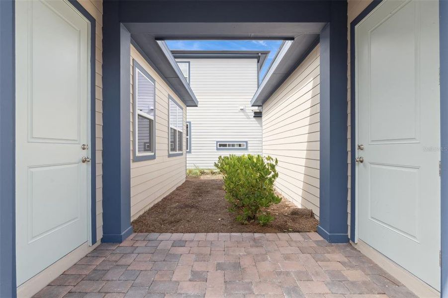 Exterior details and patio area of a home in Weslyn Park at Sunbridge (Craft Homes), St. Cloud (Image 22).