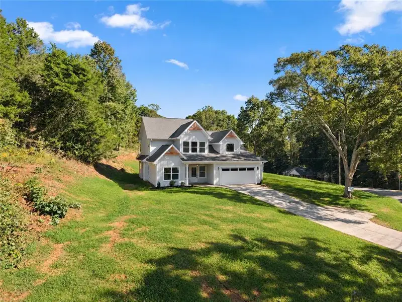 Front exterior of a new home in , Gainesville, GA, highlighting curb appeal (Image 20).