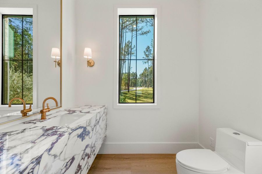 View of the powder bath located off living room. View of the powder bath located off living room.
