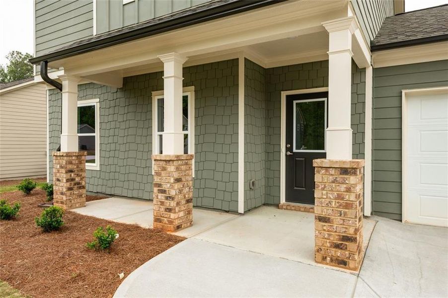 Front exterior of a new home in , Lawrenceville, GA, highlighting curb appeal (Image 17).