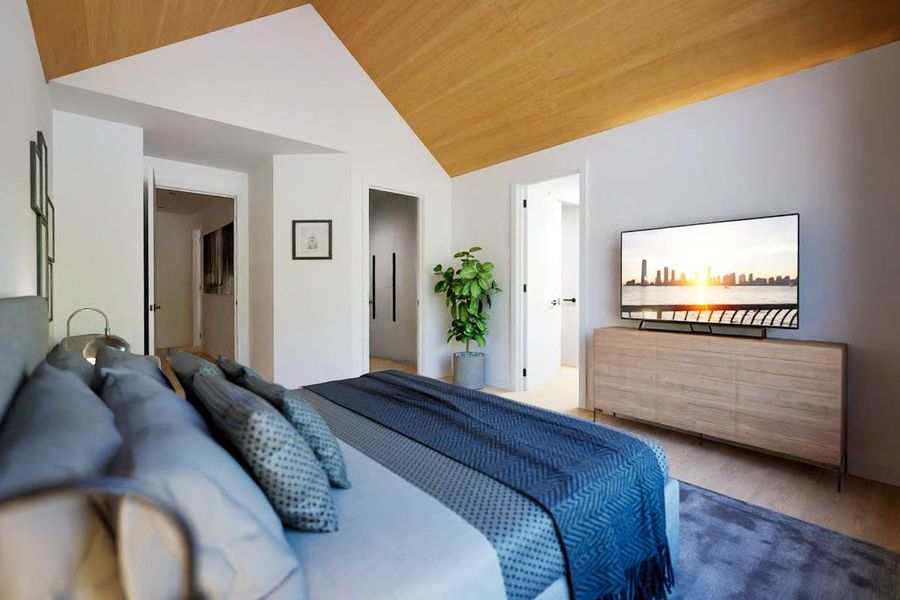 Bedroom with vaulted ceiling and wood floors to add warmth. Bedroom with vaulted ceiling and wood floors to add warmth.