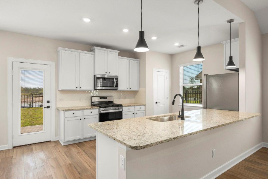 Furnished interior view inside a new home in Sunterra, Katy (Image 3).