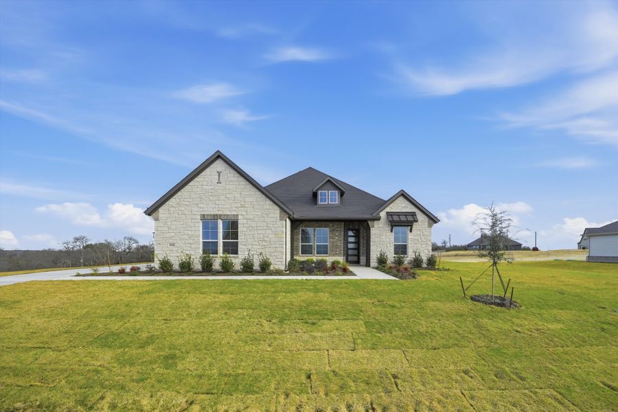 Front exterior of a new home in Eagle Ridge Estates, Weatherford, TX, highlighting curb appeal (Image 22).