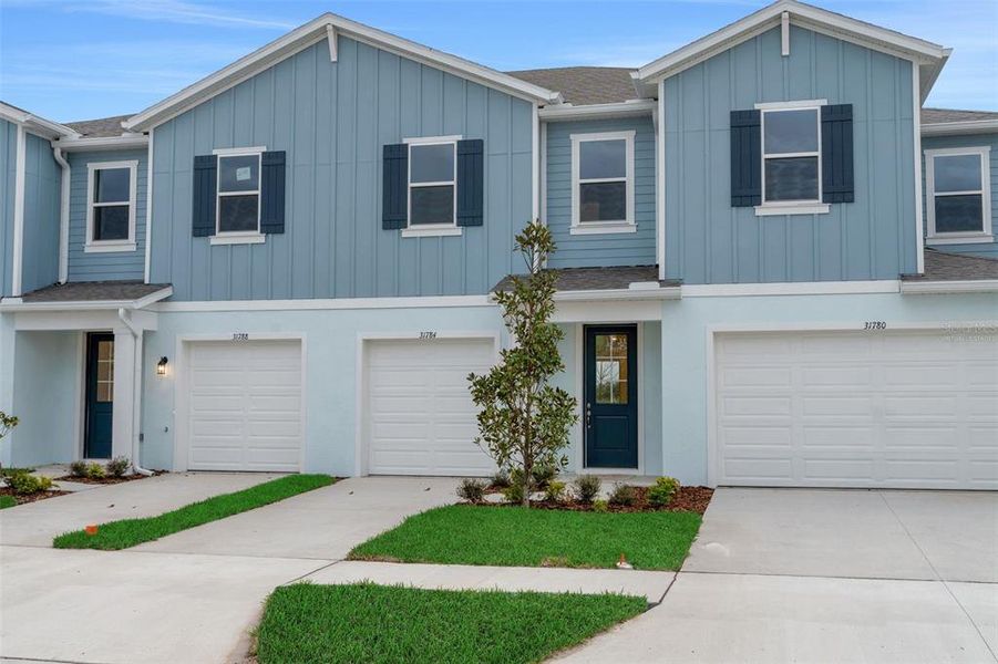 Front exterior of a new home in Shores at Mirada, San Antonio, FL, highlighting curb appeal (Image 17).