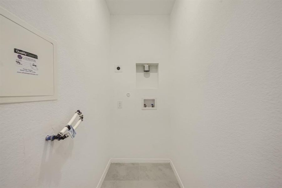 Washroom featuring washer and dryer hookup.