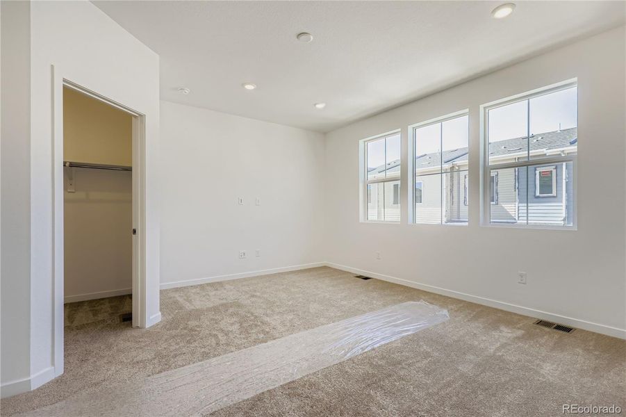 Spacious, unfurnished interior of a new home in Parterre: The Parkside Collection, Thornton (Image 10).