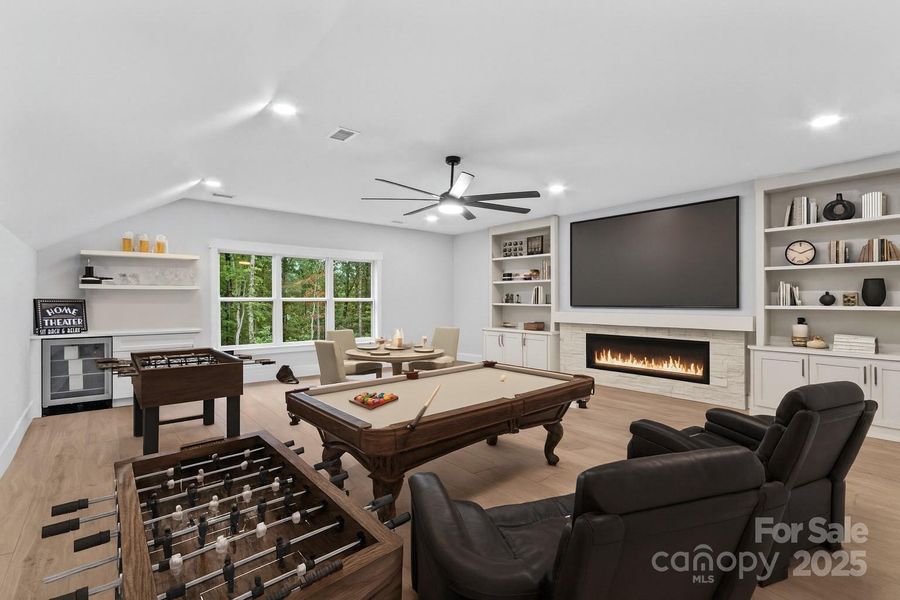 Bedroom 5 or huge Media/Game room. The fireplace & built ins by the fireplace are virtually staged.