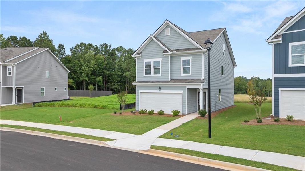 Front exterior of a new home in The Retreat at Walden Park, Jonesboro, GA, highlighting curb appeal (Image 2).