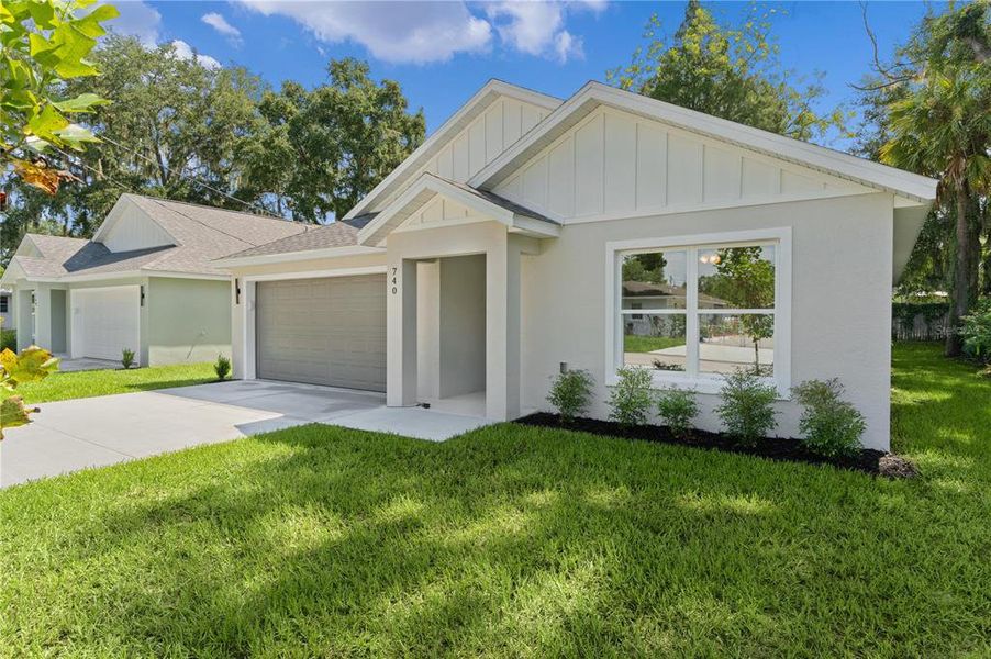 Front exterior of a new home in , Ocklawaha, FL, highlighting curb appeal (Image 21).