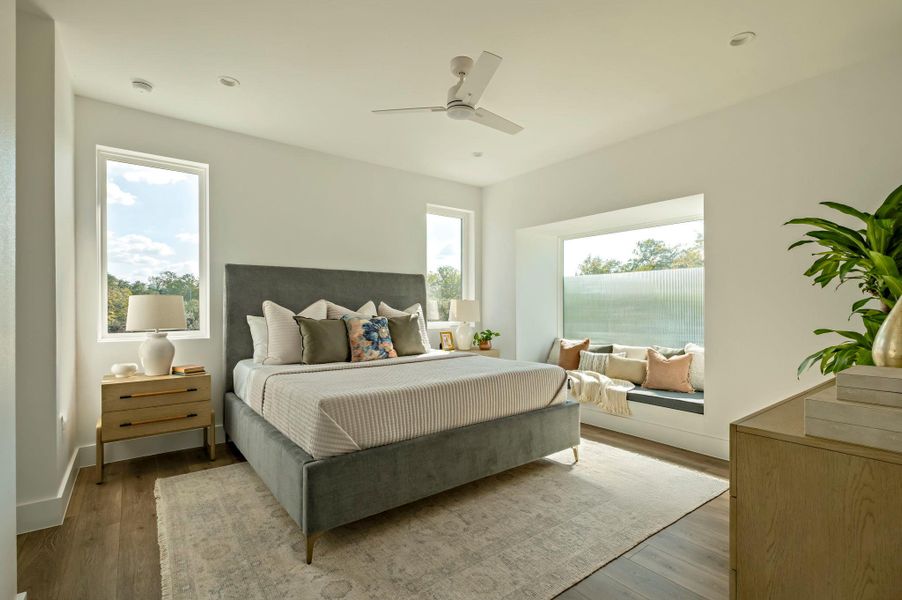 Primary bedroom featuring window seat with built-in storage Primary bedroom featuring window seat with built-in storage