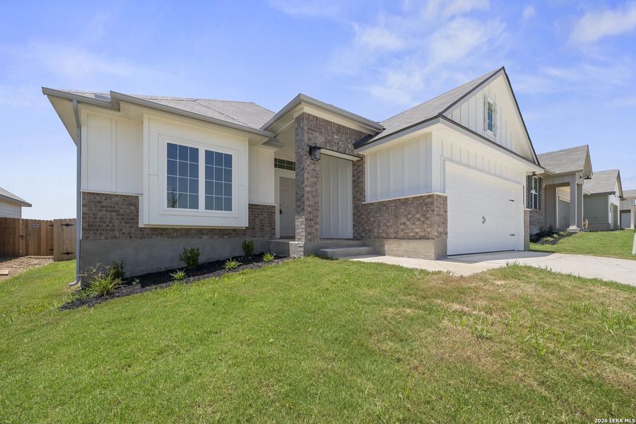 Front exterior of a new home in Arroyo Ranch, Seguin, TX, highlighting curb appeal (Image 19). Front exterior of a new home in Arroyo Ranch, Seguin, TX, highlighting curb appeal (Image 19).