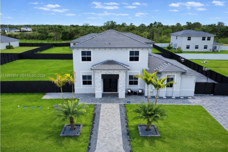 Front exterior of a new home in , Homestead, FL, highlighting curb appeal (Image 21).