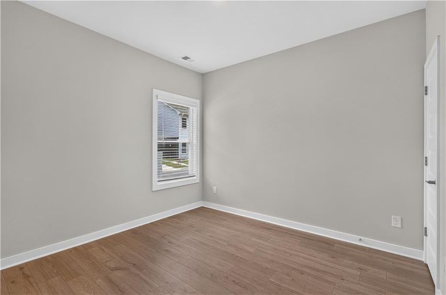 Spacious, unfurnished interior of a new home in The Cottages at East Lanier, Fayetteville (Image 17).