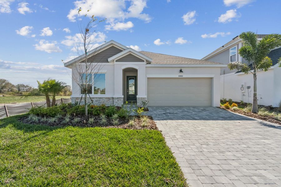 Representative exterior photo of a completed home built from the The Sanborn by David Weekley Homes in North River Ranch – Garden Series, Parrish, FL (Image 2). Representative exterior photo of a completed home built from the The Sanborn by David Weekley Homes in North River Ranch – Garden Series, Parrish, FL (Image 2).