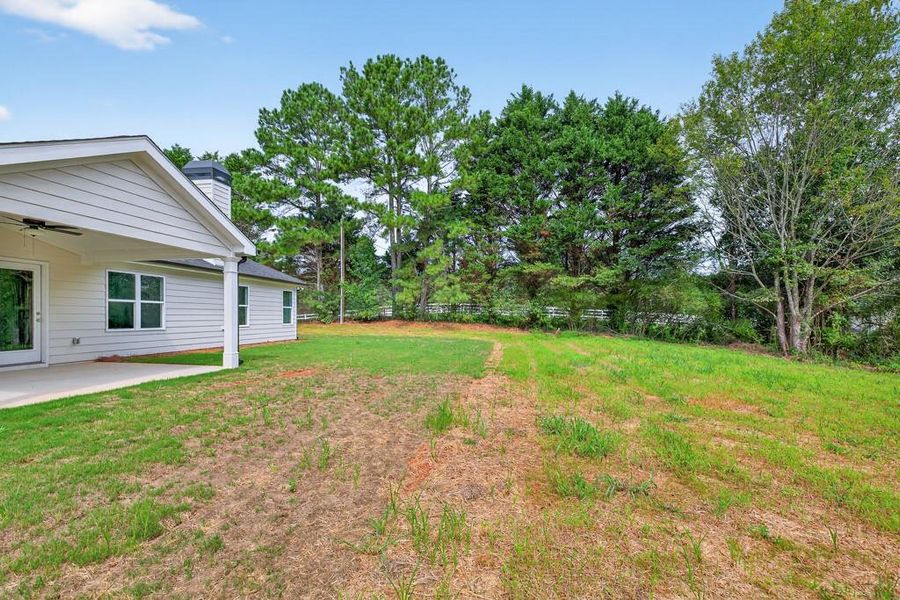 Front exterior of a new home in , Statham, GA, highlighting curb appeal (Image 20).