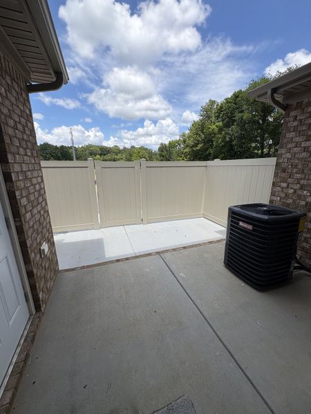 Patio with fence and storage closet