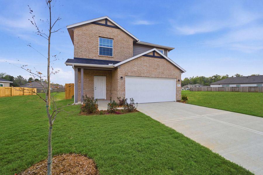 Front exterior of a new home in Caney Mills, Conroe, TX, highlighting curb appeal (Image 26).