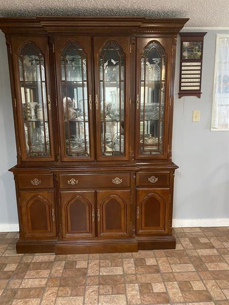 Room details with a textured ceiling and tile flooring Room details with a textured ceiling and tile flooring