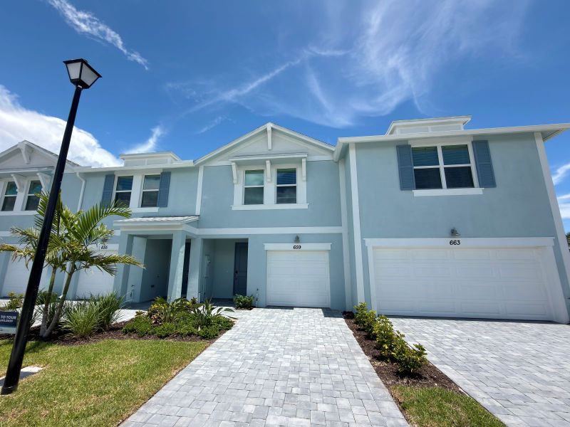 Front exterior of a new home in Tidewater, Fort Pierce, FL, highlighting curb appeal (Image 10). Front exterior of a new home in Tidewater, Fort Pierce, FL, highlighting curb appeal (Image 10).