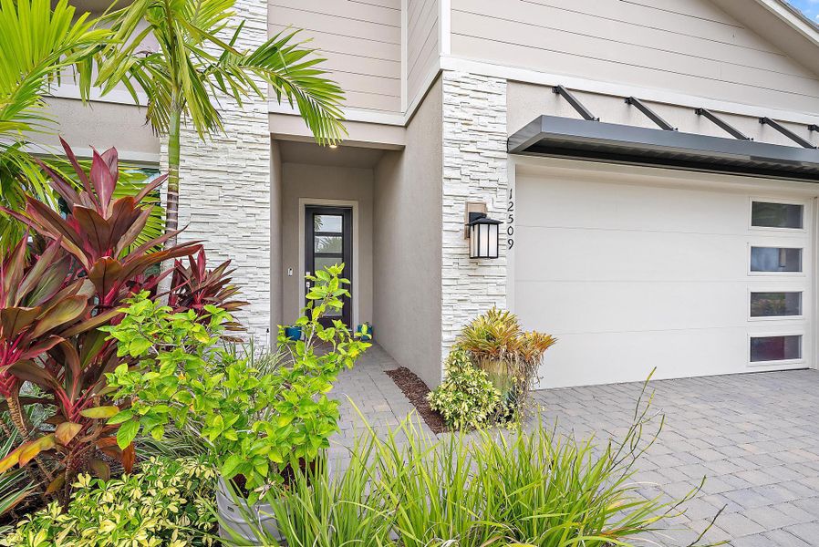 Exterior details and patio area of a home in Avondale at Avenir, Palm Beach Gardens (Image 22).