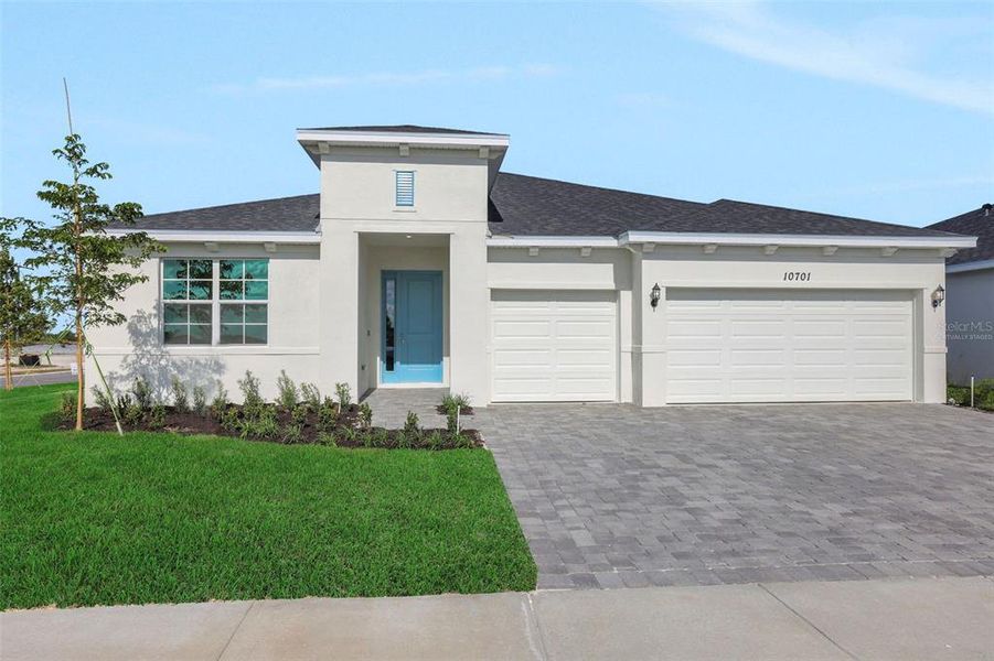 Front exterior of a new home in Brystol North at Wylder, Port St. Lucie, FL, highlighting curb appeal (Image 14).