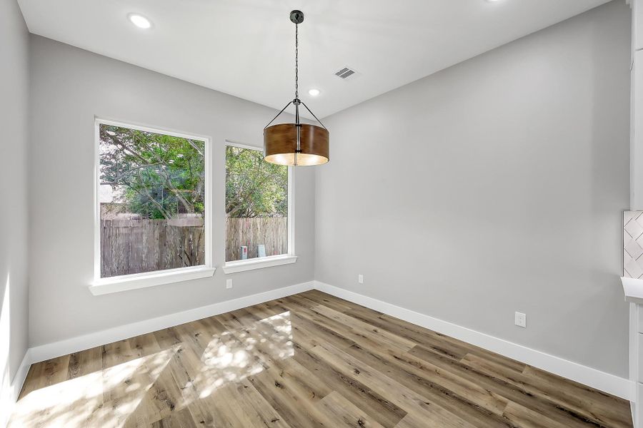 Light-filled dining area conveniently located just off the kitchen for easy entertaining