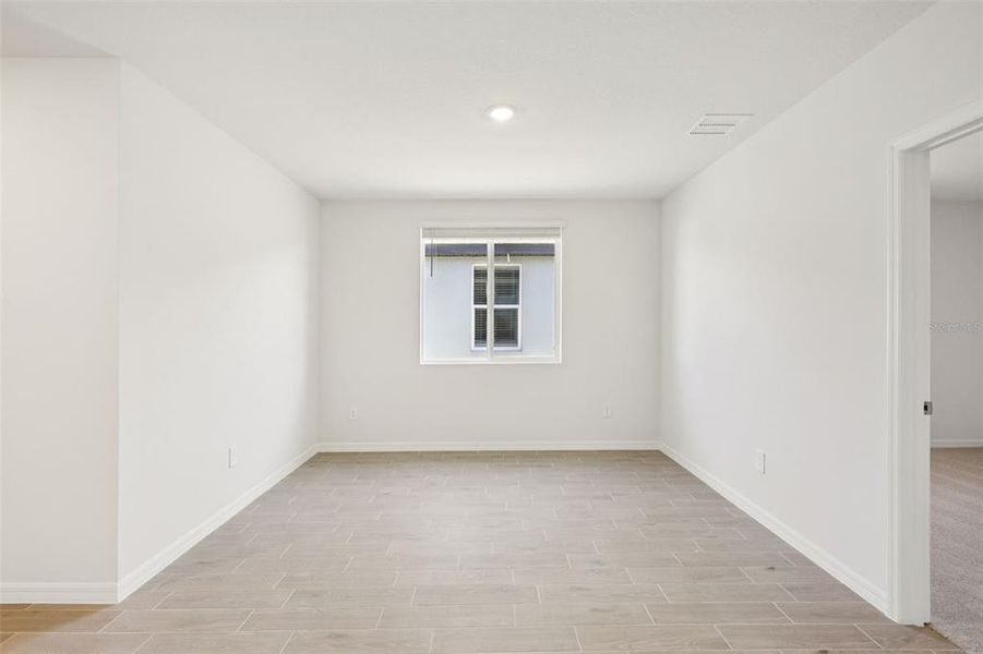 Spacious, unfurnished interior of a new home in The Grove at Stuart Crossing - Classic Series, Bartow (Image 27).