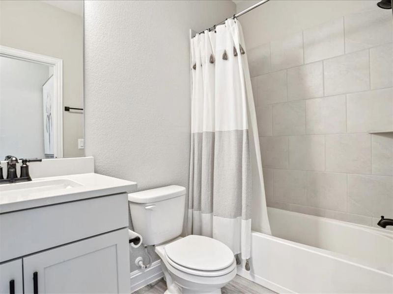 A full bathroom on the first floor means overnight guests have it easy—and even the pups get their own spa day setup for quick baths. A full bathroom on the first floor means overnight guests have it easy—and even the pups get their own spa day setup for quick baths.