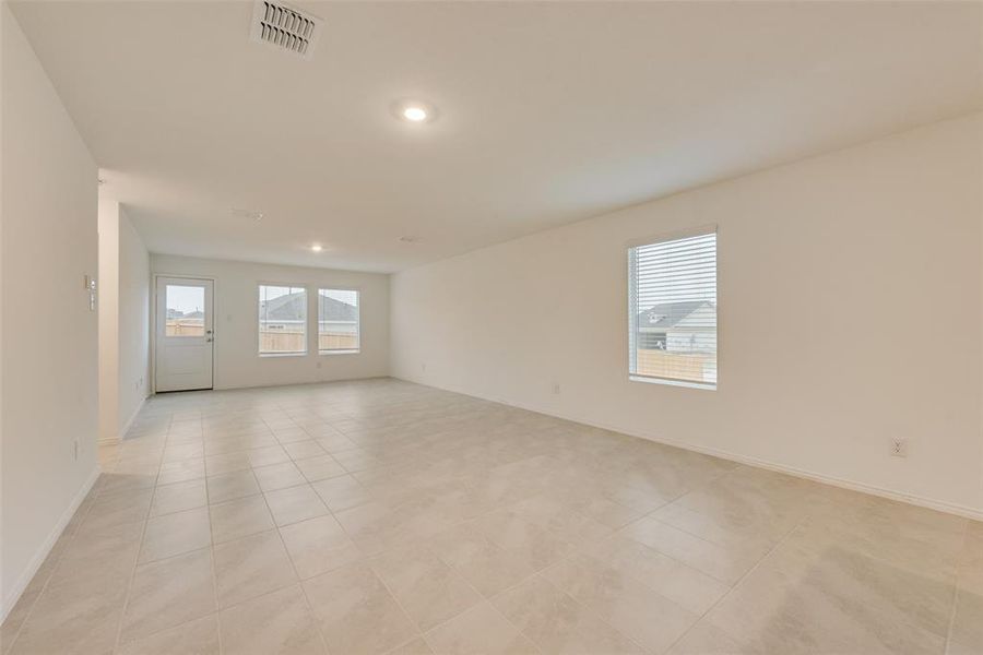 Spare room with light tile patterned floors