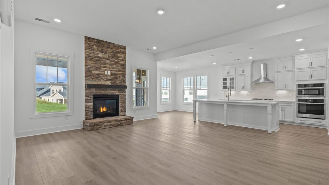 Hardwood flooring and high standards define this vibrant family room ideal for everyday living
