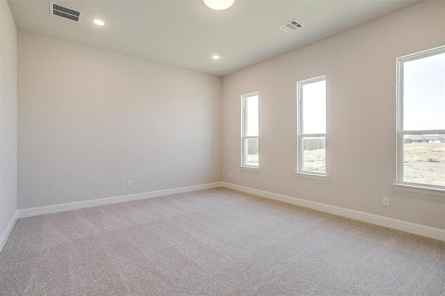 Spare room featuring light colored carpet