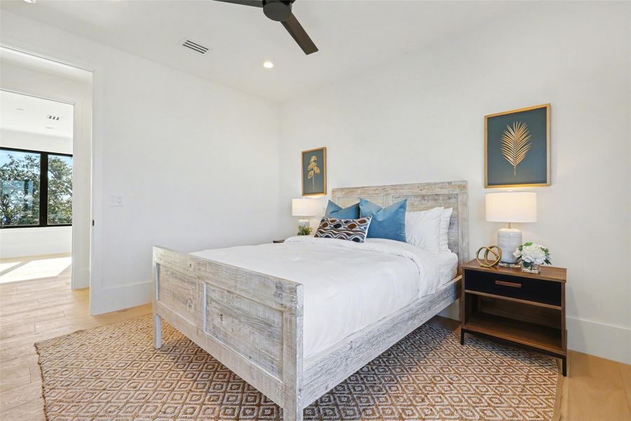 Bedroom featuring ceiling fan, recessed lighting, and light wood finished floors
