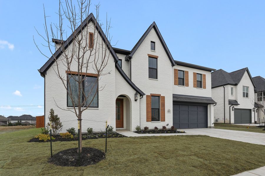 Front exterior of a new home in Park Place - 80' Lots, Prosper, TX, highlighting curb appeal (Image 2). Front exterior of a new home in Park Place - 80' Lots, Prosper, TX, highlighting curb appeal (Image 2).