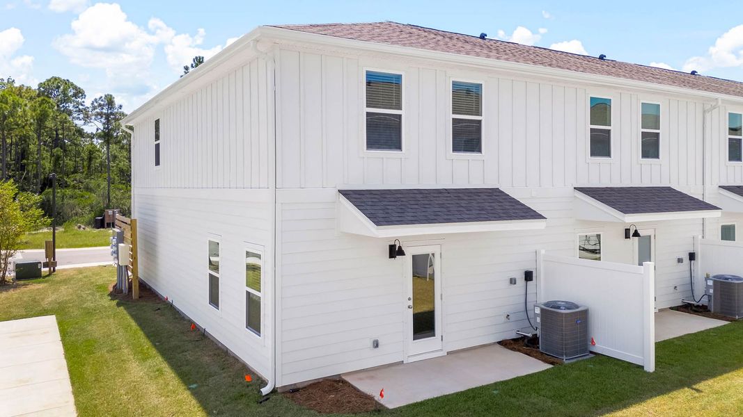 Exterior details and patio area of a home in Hawks Landing Townhomes, Santa Rosa Beach (Image 2). Exterior details and patio area of a home in Hawks Landing Townhomes, Santa Rosa Beach (Image 2).